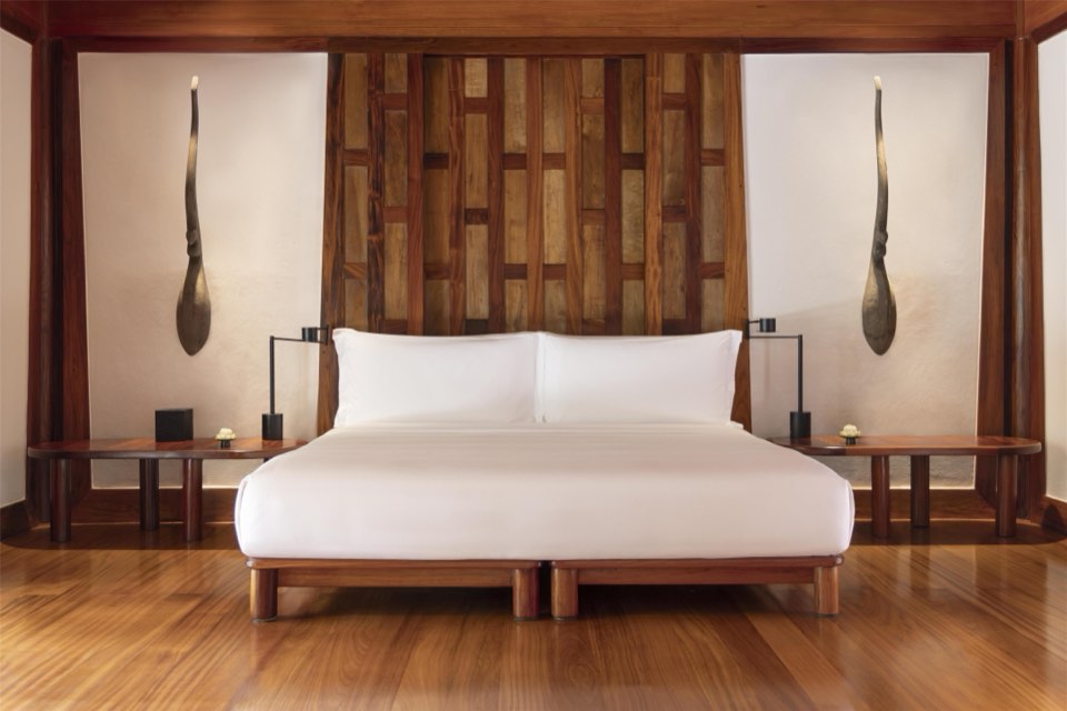A teak-panelled pavilion bedroom at Amanpuri, Phuket