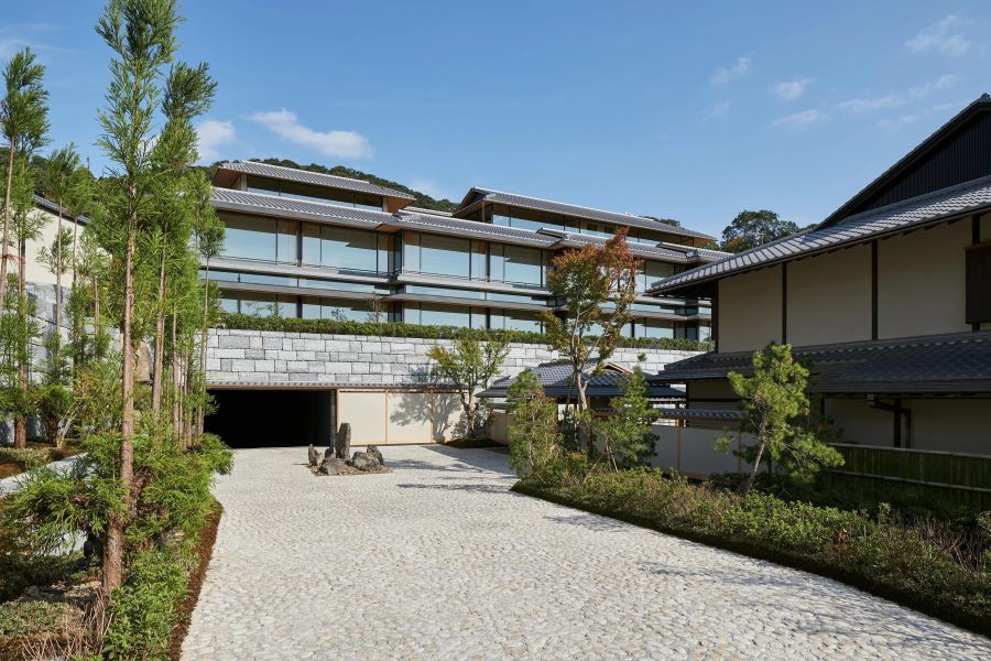 Park Hyatt Kyoto's low timber buildings among pines in Higashiyama